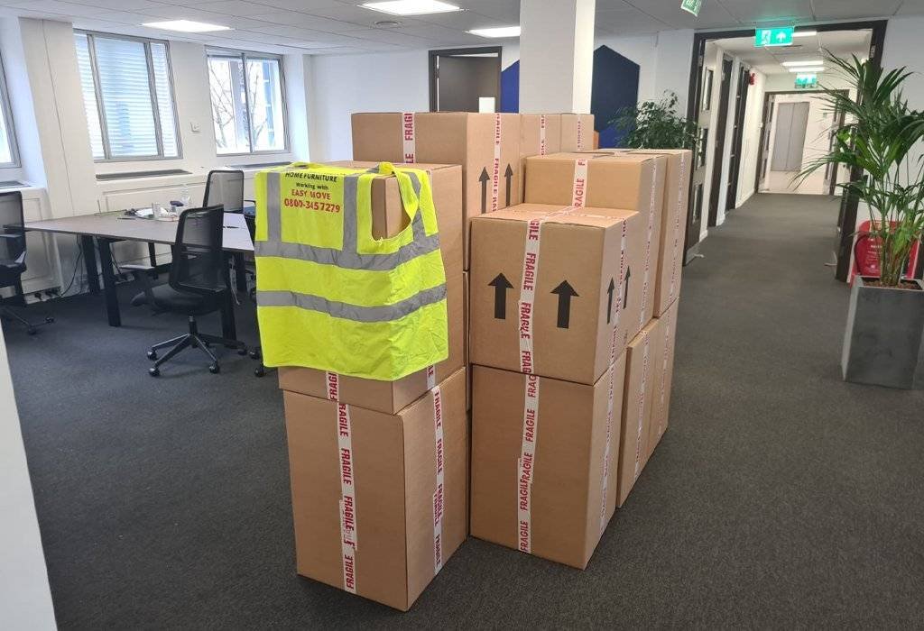 There are the packed boxes of luggage of the office and are ready for loading in trucks for moving