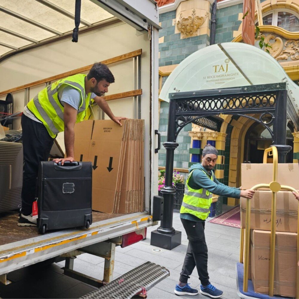 24/7 Movers Packers London team loading packing materials and transporting boxes outside Taj 51 Buckingham Gate Suites and Residences, delivering professional moving and storage services.